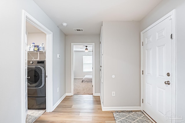 4366 White Cedar Ct, Pace, FL 32571 - laundry area with washer / clothes dryer, light wood-style floors, a ceiling fan, and baseboards