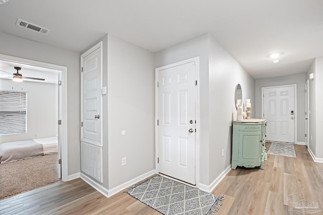 4366 White Cedar Ct, Pace, FL 32571 - entryway with light wood-style flooring, baseboards, and ceiling fan