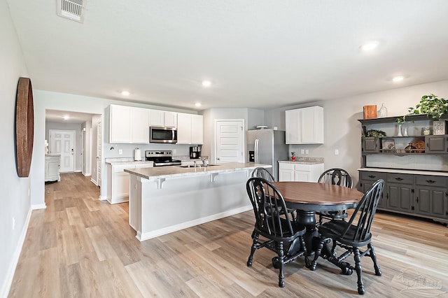 4366 White Cedar Ct, Pace, FL 32571 - dining room with light wood-style floors, recessed lighting, and baseboards