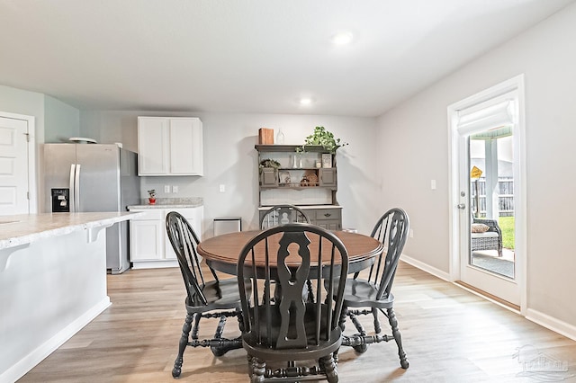 4366 White Cedar Ct, Pace, FL 32571 - dining space with light wood finished floors and baseboards