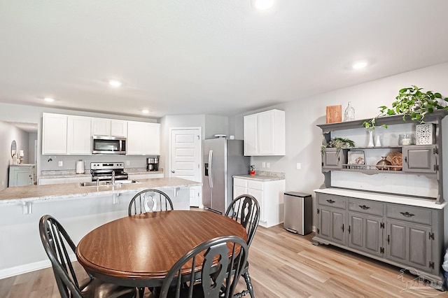 4366 White Cedar Ct, Pace, FL 32571 - dining room with light wood-type flooring and recessed lighting