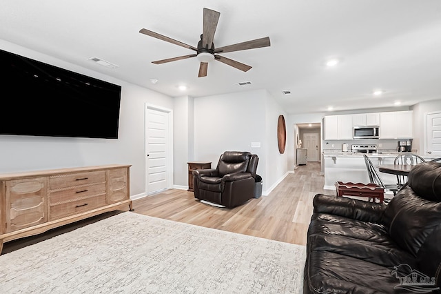 4366 White Cedar Ct, Pace, FL 32571 - living room featuring ceiling fan, light wood-type flooring, recessed lighting, and baseboards