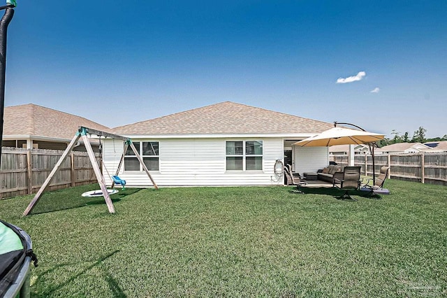 4366 White Cedar Ct, Pace, FL 32571 - back of property featuring an outdoor hangout area, roof with shingles, and a patio area