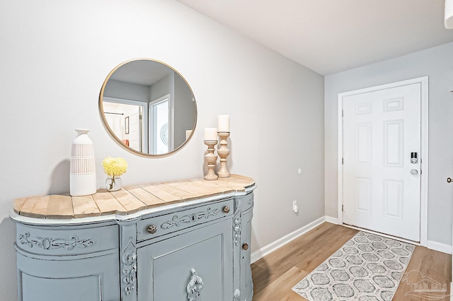4366 White Cedar Ct, Pace, FL 32571 - foyer with light wood-style floors and baseboards