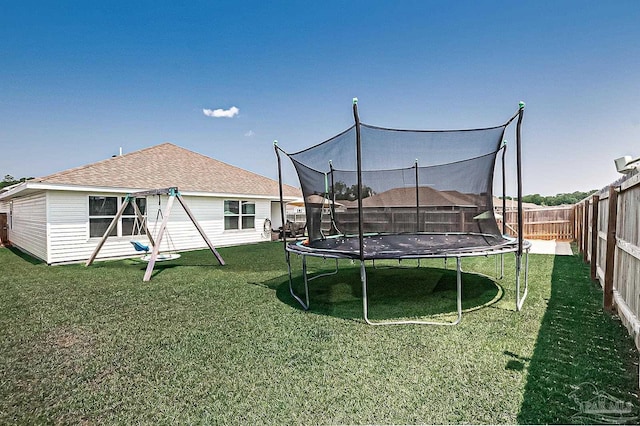 4366 White Cedar Ct, Pace, FL 32571 - view of yard featuring a trampoline