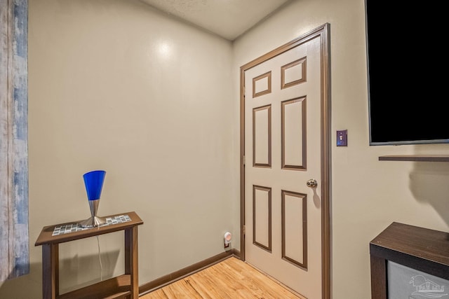 entryway with wood-type flooring