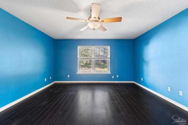 unfurnished room with hardwood / wood-style flooring, a ceiling fan, baseboards, and a textured ceiling