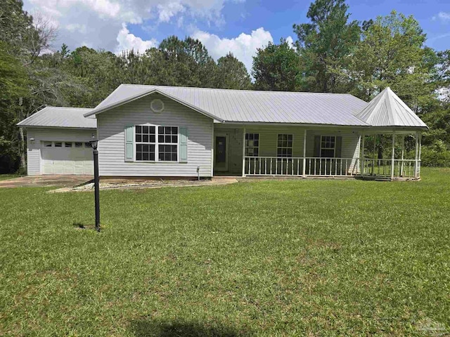 view of front of property with metal roof, a porch, and a front lawn
