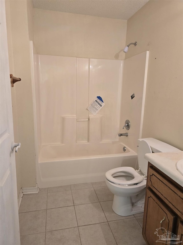 full bath featuring vanity, toilet, a textured ceiling, tile patterned floors, and  shower combination