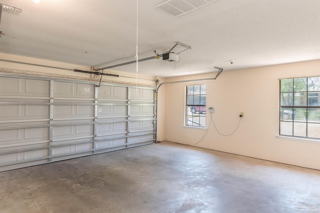 308 Twisted Oak Dr, Cantonment, FL 32533 - garage featuring a garage door opener and visible vents