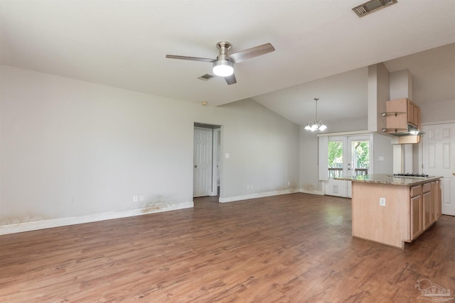 308 Twisted Oak Dr, Cantonment, FL 32533 - kitchen featuring visible vents, light brown cabinets, and vaulted ceiling