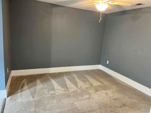 carpeted empty room with ceiling fan