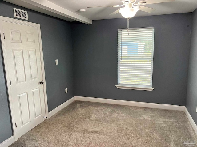 carpeted spare room with ceiling fan