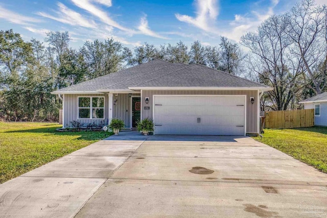 ranch-style home featuring board and batten siding, concrete driveway, fence, and a front lawn