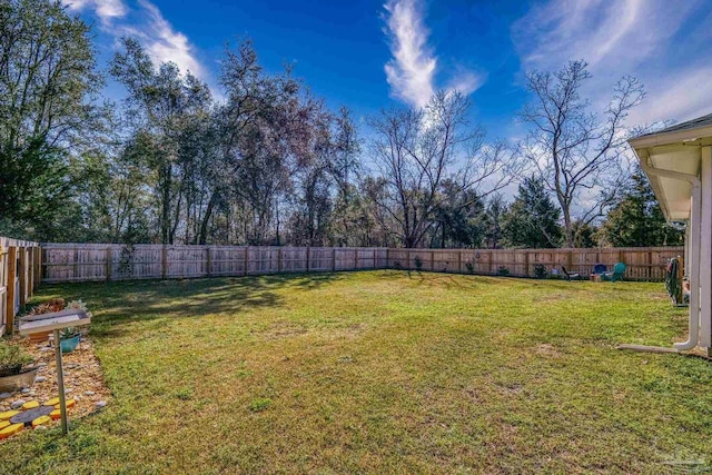 view of yard with a fenced backyard