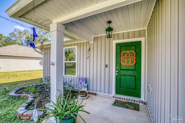 doorway to property featuring board and batten siding