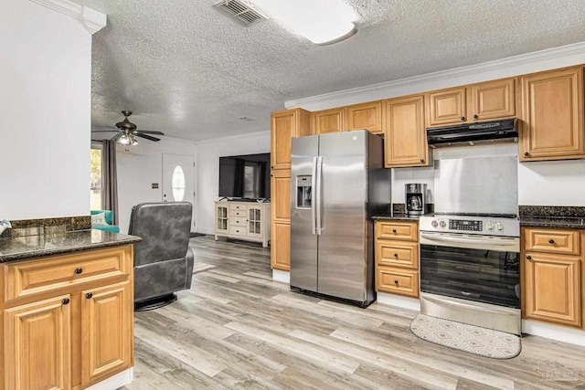 kitchen featuring visible vents, ceiling fan, under cabinet range hood, appliances with stainless steel finishes, and light wood-style floors