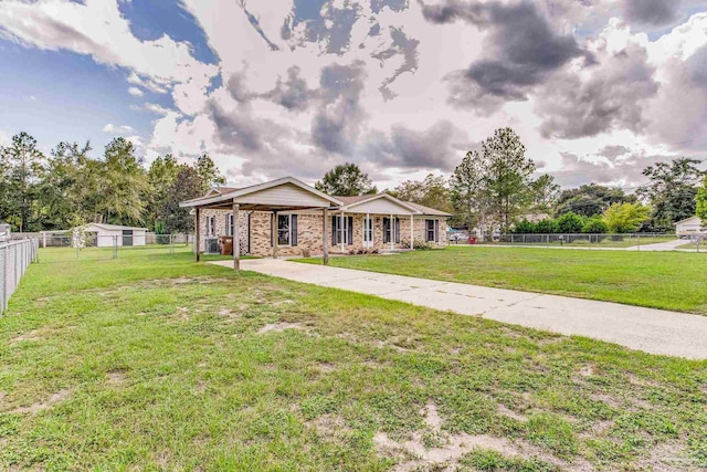 view of front of home with a fenced backyard and a front lawn