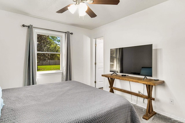 bedroom with carpet flooring, baseboards, and ceiling fan