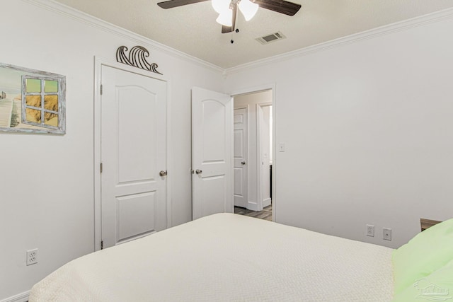 bedroom featuring ceiling fan, baseboards, visible vents, and ornamental molding