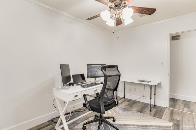 office area with ornamental molding, a ceiling fan, and wood finished floors