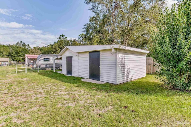 view of shed with a fenced backyard