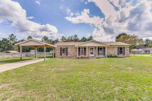 ranch-style home with a detached carport, concrete driveway, a front lawn, and fence