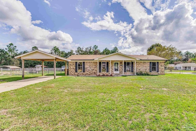 single story home featuring brick siding, driveway, a front yard, and fence