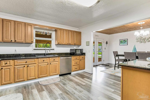 kitchen with a sink, light wood-style floors, black microwave, and stainless steel dishwasher