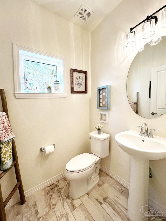 bathroom with sink and toilet