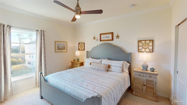 bedroom featuring ceiling fan, light colored carpet, and ornamental molding