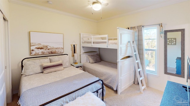 carpeted bedroom with ornamental molding