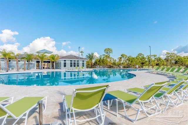 view of swimming pool featuring a patio area