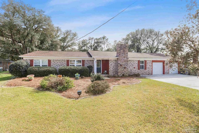 ranch-style house with a garage, driveway, a chimney, and a front lawn