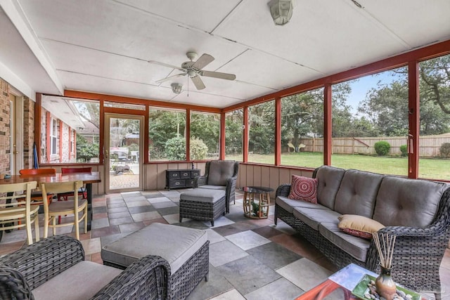 sunroom / solarium with ceiling fan and a wealth of natural light