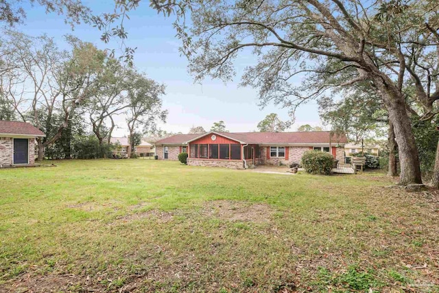 view of yard featuring a sunroom