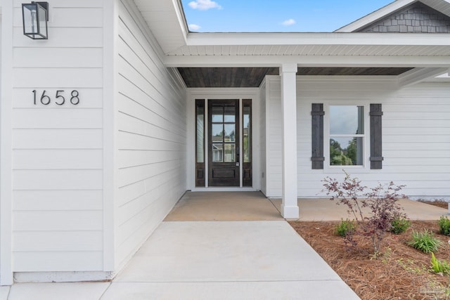 entrance to property with covered porch