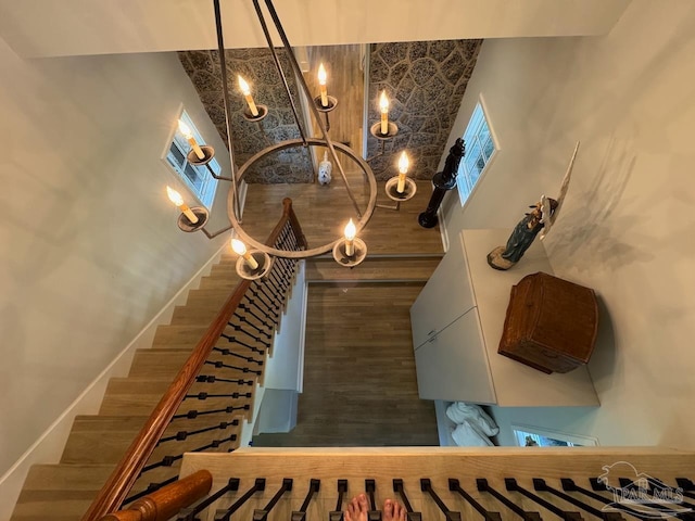 staircase featuring a towering ceiling