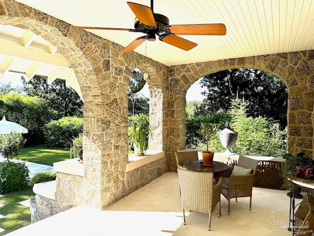 view of patio featuring ceiling fan