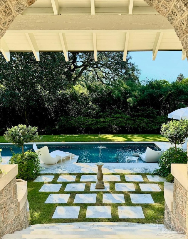 view of swimming pool featuring a patio area and pool water feature