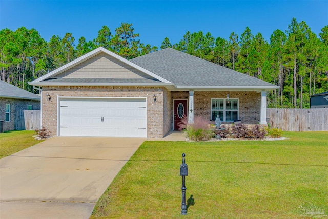 view of front of home featuring a garage and a front yard