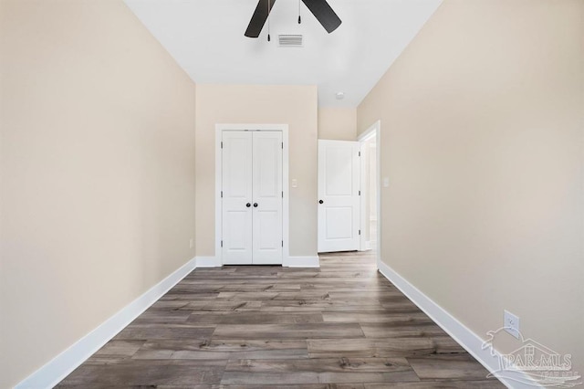 hall featuring dark wood-type flooring