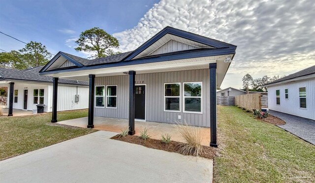 back of house with a patio area