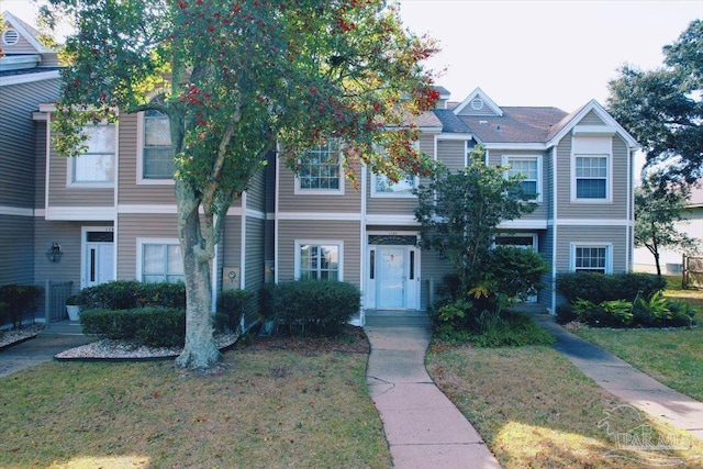 view of property with a front lawn