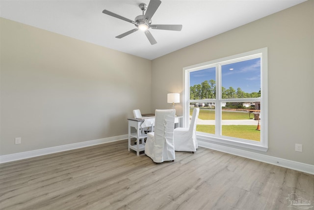 2098 Anna Ct, Milton, FL 32583 - dining area featuring light wood-style floors, baseboards, ceiling fan, and a desk