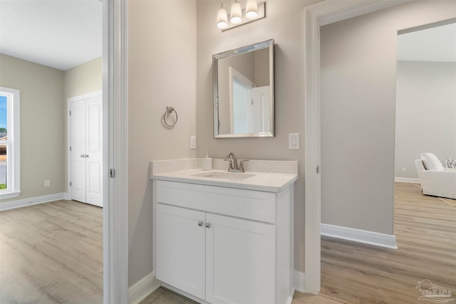 bathroom with wood-type flooring and vanity