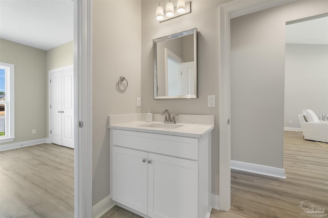 2098 Anna Ct, Milton, FL 32583 - bathroom featuring wood finished floors, baseboards, and vanity