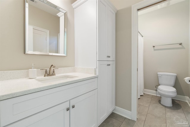 2098 Anna Ct, Milton, FL 32583 - full bathroom with vanity, tile patterned floors, toilet, baseboards, and a shower with shower curtain
