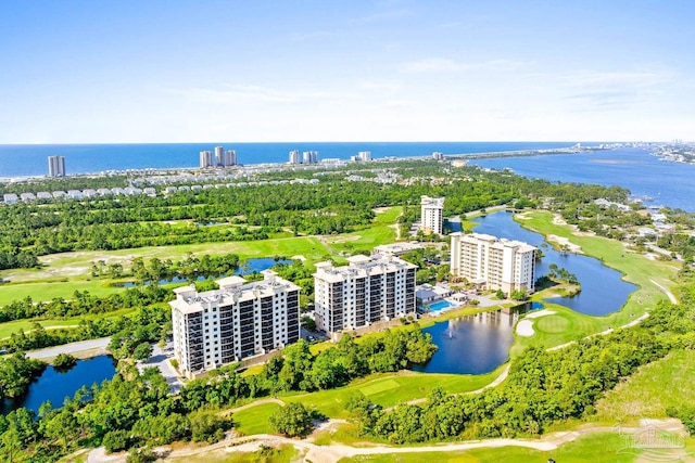 612 Lost Key Dr Unit 702-B, Pensacola, FL 32507 - aerial view of apartment complex, a nearby body of water, a golf club, and a tree filled landscape