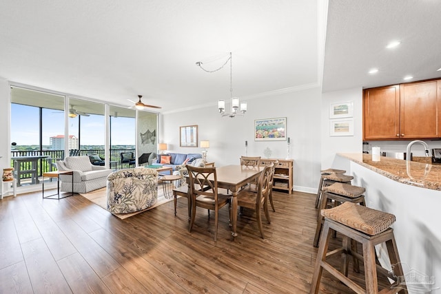612 Lost Key Dr Unit 702-B, Pensacola, FL 32507 - dining space featuring dark wood finished floors, floor to ceiling windows, ceiling fan, recessed lighting, and a chandelier